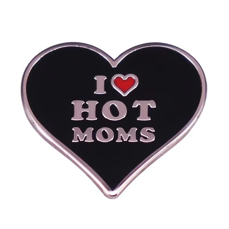  I ♥ HOT MOMS enamel pin features a heart shape, silver edges, and playful white text with a red love heart symbol—perfect for adding fun flair to any outfit.