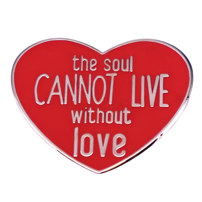The My Cutesy Era enamel pin features a red love heart with white text that says, the soul CANNOT LIVE without love.