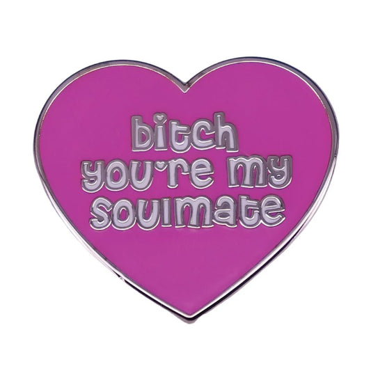 Show your affection with My Cutesy Eras pink heart-shaped enamel pin, featuring silver edges and bitch youre my soulmate in playful silver letters—a fun gift for your special someone.