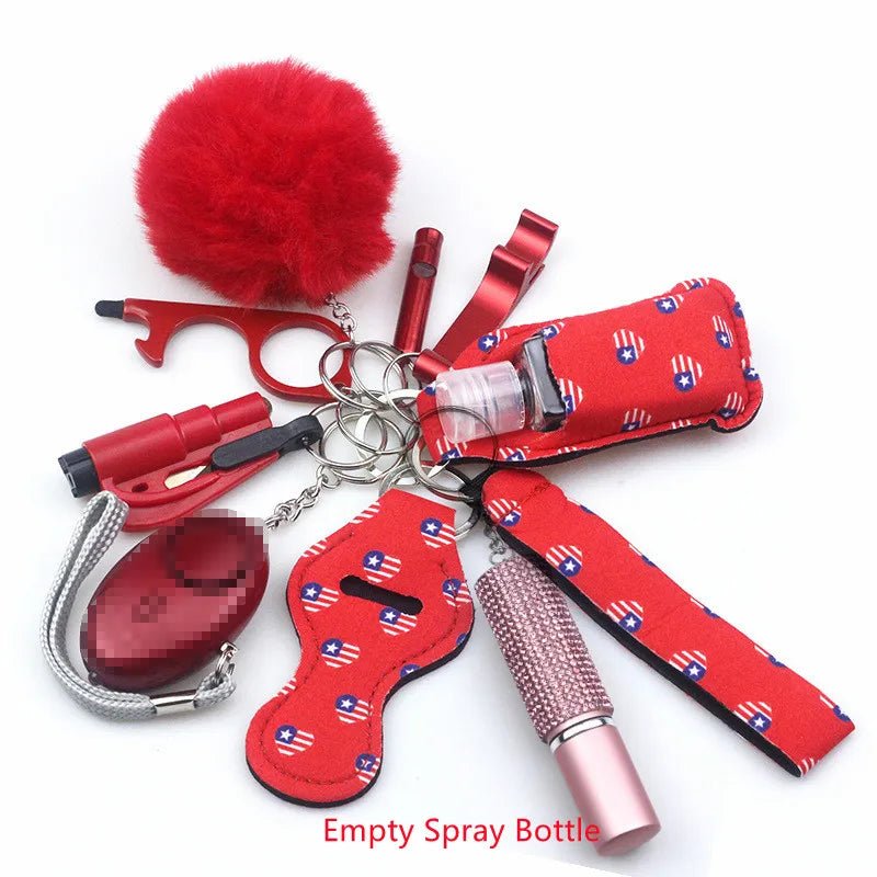 The Kiss Me Later keychain set includes a pom-pom, whistle, lip balm holder, empty spray bottle, alarm, and patterned fabric holders—perfect for outdoor adventures. Features text: Empty Spray Bottle.