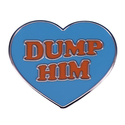 My Cutesy Era pink love heart pin features bold orange “DUMP HIM” lettering on a blue background.