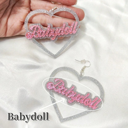 Heart-shaped earrings with 'Babydoll' text