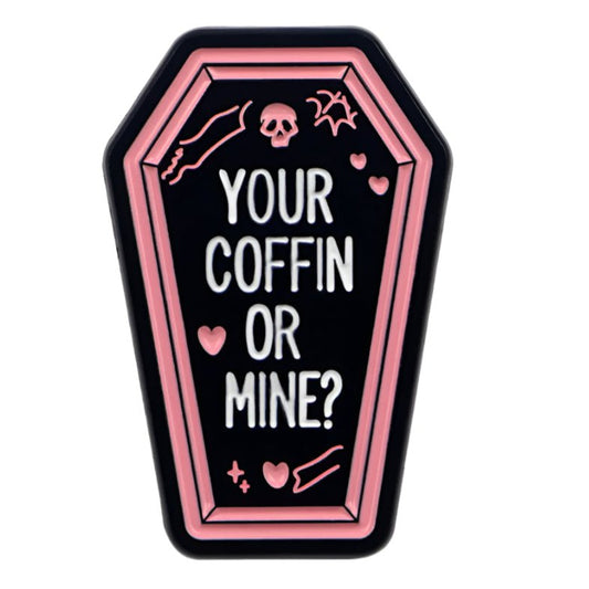 This badge features a black coffin with a pink outline, YOUR COFFIN OR MINE? text, and icons like a skull, bat, hearts, and sparkles—an ideal accessory for any true crime fan.