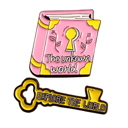 A pink book badge with a keyhole and The Unknown World text sits beside a yellow Explore The World key pin. Both feature cartoonish style, bold black outlines