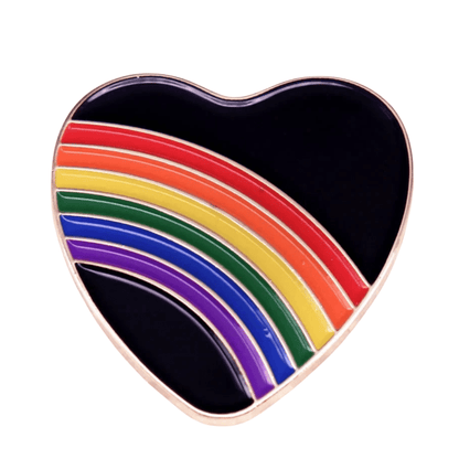 Rainbow and black love heart enamel pin features red, orange, yellow, green, blue, and purple rainbow stripes—making it a bold and perfect pride accessory for any collection.
