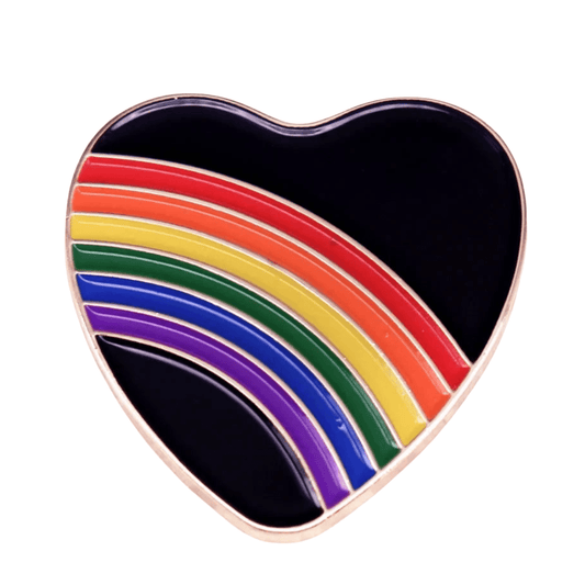 Rainbow and black love heart enamel pin features red, orange, yellow, green, blue, and purple rainbow stripes—making it a bold and perfect pride accessory for any collection.