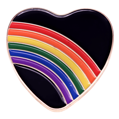 Heart-shaped pin with rainbow design on a white background