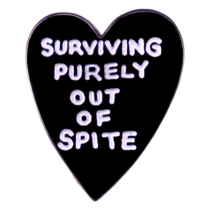 My Cutesy Eras black love heart enamel pin features white text, SURVIVING PURELY OUT OF SPITE. This bold accessory is inspired by intersectional feminism pin designs.