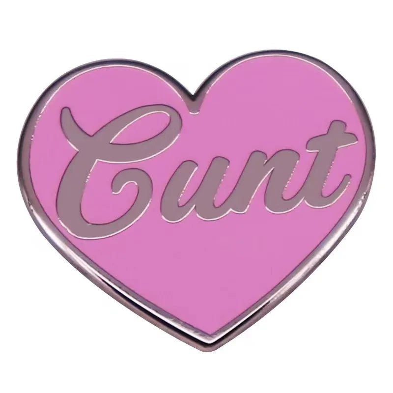 heart-shaped badge features a pink background with silver cursive. Add bold flair to any outfit—worldwide shipping available.