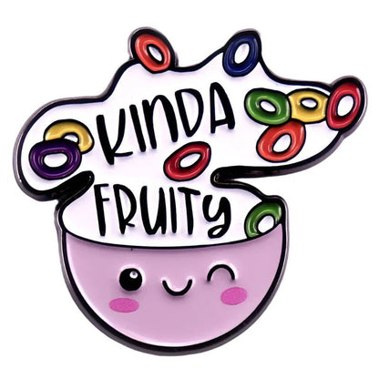 A cute, purple bowl winks under “KINDA FRUITY” with bright fruit loops spilling out—this kawaii enamel pin from Kiss Me Later is a playful celebration of queer pride.