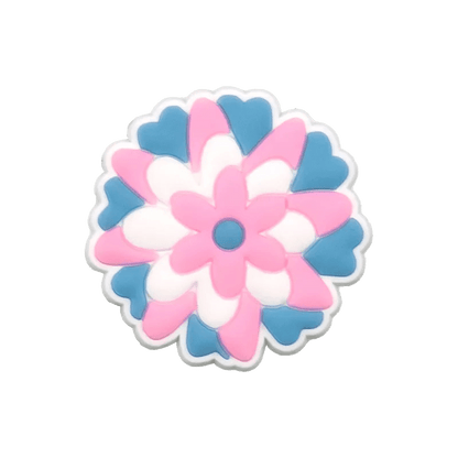 Add a splash of pride to your collection with Kiss Me Later’s round flower charm, featuring overlapping blue, white, and pink petals inspired by the Trans Flag and a blue center on a plain transparent background.