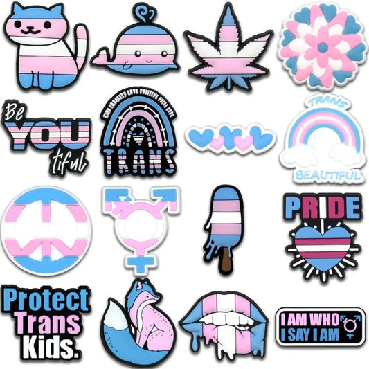 trans flag pride charms feature the Trans and Rainbow Flags, with designs like a cat, whale, leaf, hearts, fox, ice pop, lips, and affirming messages that celebrate trans identity.