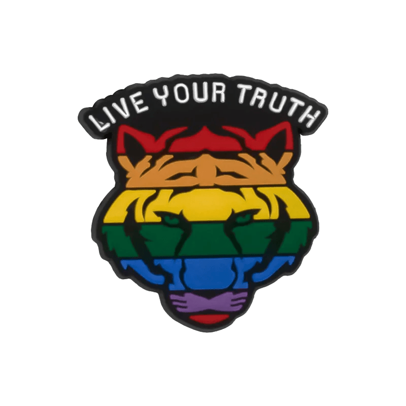 A stylized tiger head with rainbow stripes and green eyes, symbolizing LGBTQ+ pride, features pride charms and LIVE YOUR TRUTH above it in bold white letters. From the brand Kiss Me Later.