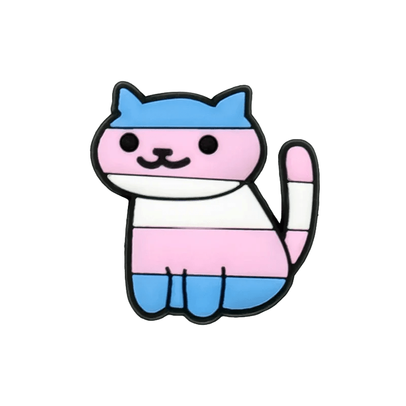 Kiss Me Later’s cartoon cat features bold outlines and Trans Flag colors—blue, pink, and white stripes. The smiling cat sits with its tail curled upward, accented by playful pride charms for a whimsical, affirming look.