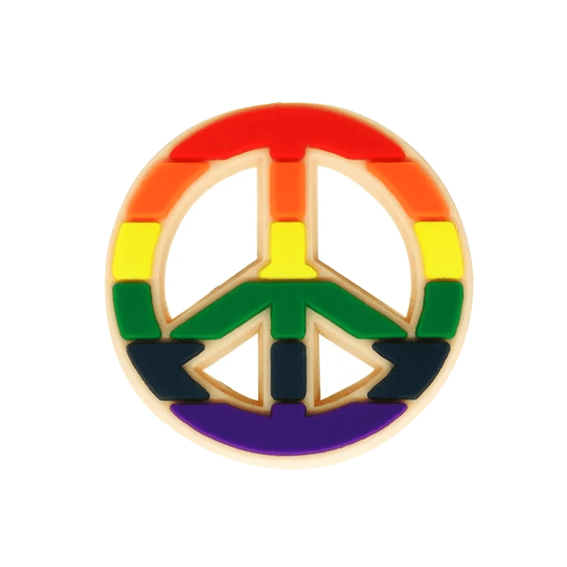 The Kiss Me Later peace symbol pin features Rainbow Flag colors—red, orange, yellow, green, blue, and purple—making it a stylish pride charm that celebrates LGBTQ+ pride.