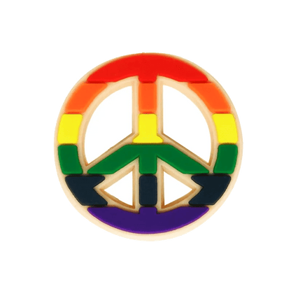 The Kiss Me Later peace symbol pin features Rainbow Flag colors—red, orange, yellow, green, blue, and purple—making it a stylish pride charm that celebrates LGBTQ+ pride.
