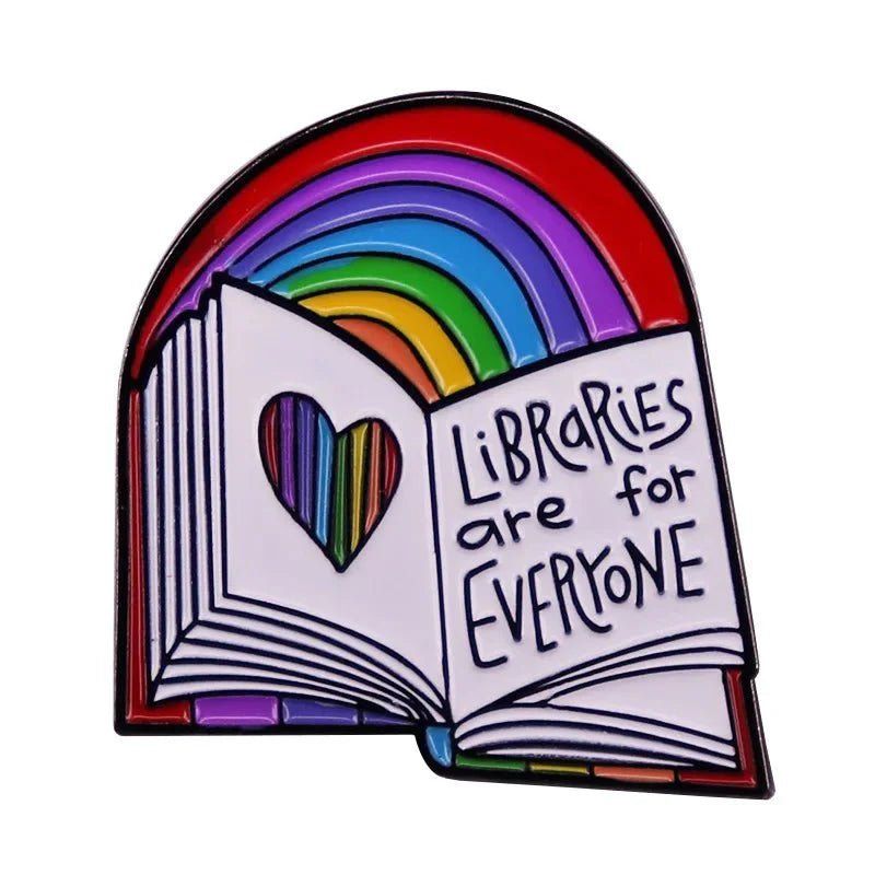 \enamel badge features an open book with a heart cutout, rainbow pages, and LIBRARIES are for EVERYONE text on a vibrant rainbow background. Worldwide shipping available.
