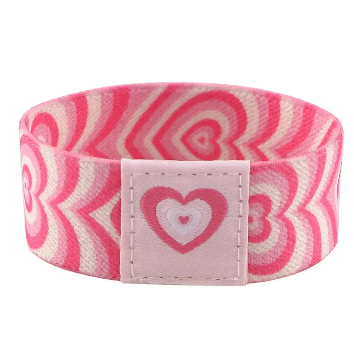 Show your support with the Gay Skate pink fabric wristband, featuring repeating heart patterns in pink and white plus a stitched patch with a layered heart design—a sweet pride accessory for any occasion.