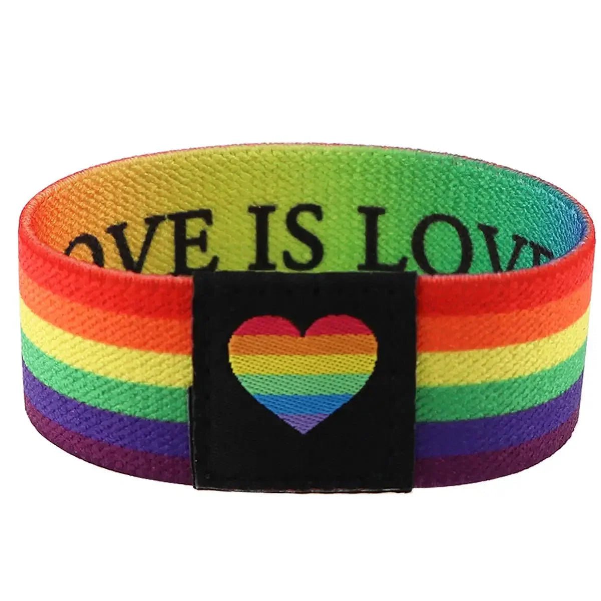 The Gay Skate wide fabric wristband has rainbow stripes, a black patch with a rainbow heart, and LOVE IS LOVE printed in black uppercase letters inside—perfect as a Pride accessory.