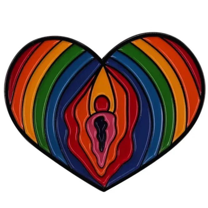 heart-shaped pin features rainbow, layered curves and a central abstract figure, inspired by the Progress Pride Flag to symbolize love, unity, and diversity.