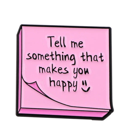 A pink sticky note with black text that reads, “Tell me something that makes you happy :)”—a simple way to spark motivation and support mental health.