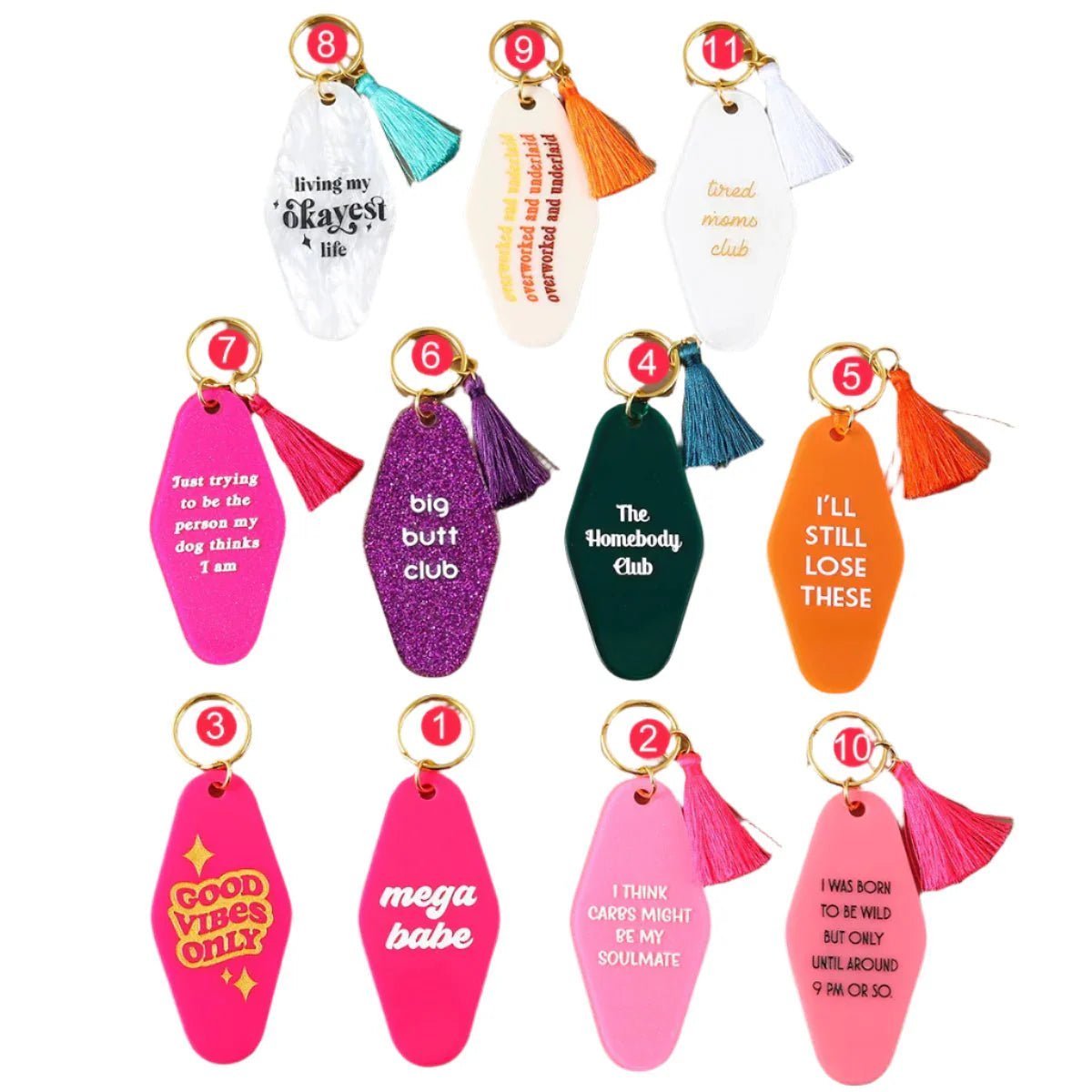 Ten colorful hotel key rings with tassels, each showing a unique funny message in bold pink, orange, purple, white, or yellow. Each 12cm ring is arranged in two rows and available for worldwide shipping.