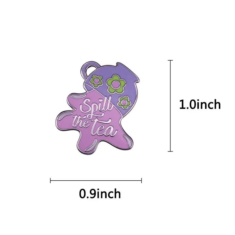 My Cutesy Era’s small purple enamel pin (1.0 x 0.9 in), shaped like spilled liquid with flowers, features “Spill The Tea” in white cursive on a purple-pink background. Enjoy worldwide shipping on this charming accessory!.