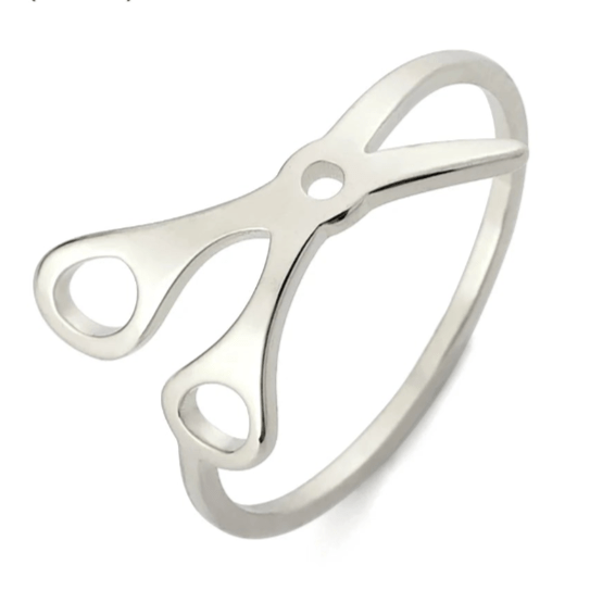 Scissor Ring is crafted from stainless steel and showcases open scissor handles and blades—an eye-catching, unique sapphic pride accessory.