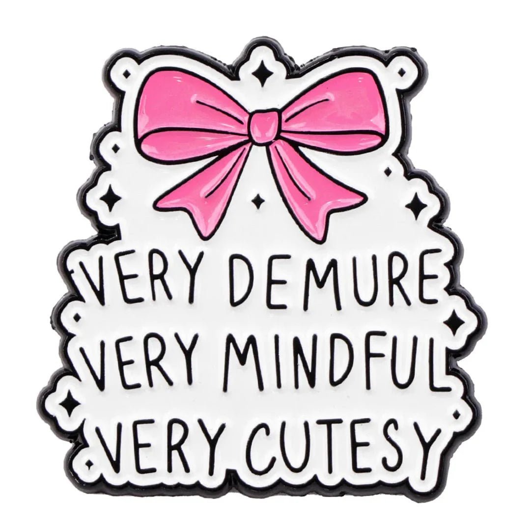 decorative sign with a striking pink bow at the top and Very demure, very mindful, very cutesy in bold black letters on a white background.