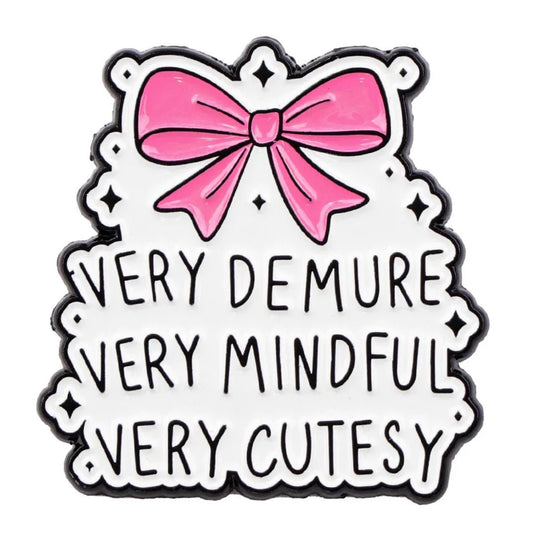 decorative sign with a striking pink bow at the top and Very demure, very mindful, very cutesy in bold black letters on a white background.