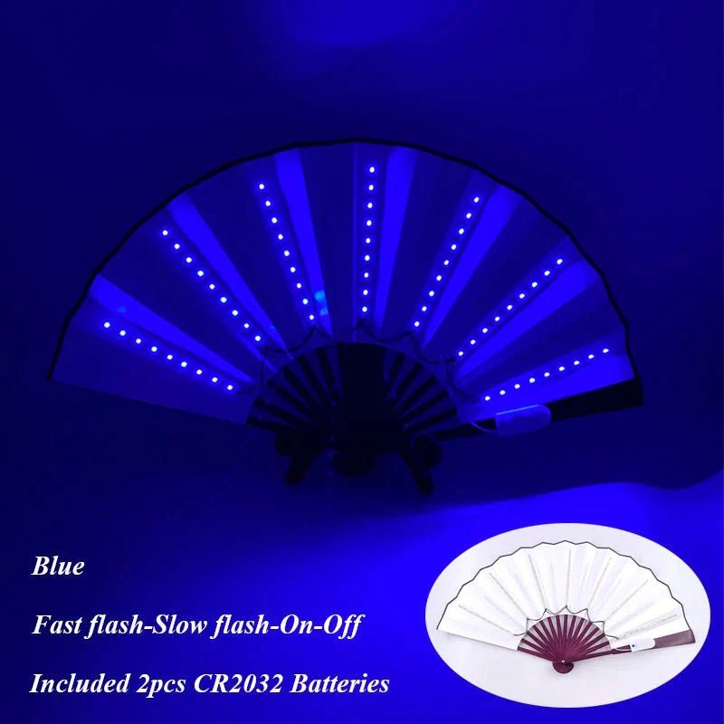 The My Cutesy Era handheld LED fan glows blue in the dark. It features Fast flash, Slow flash, and On/Off modes and includes two CR2032 batteries. An inset image shows the fan unlit. Battery powered for portable fun!.