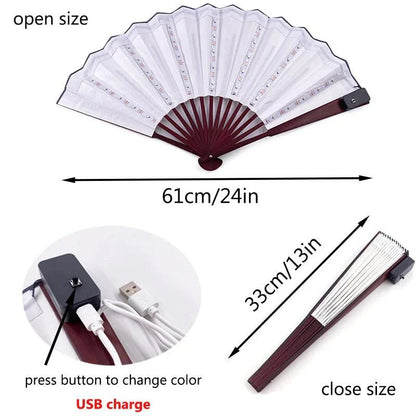 The My Cutesy Era rechargeable LED fan features a USB charging port, a color-changing button, and vibrant LED lights. It folds from 61cm (24in) open to 33cm (13in) closed, combining portability with style.