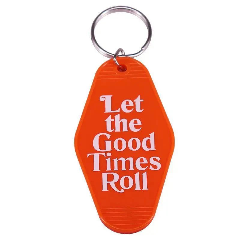 The Kiss Me Later orange retro hotel key ring features white Let the Good Times Roll text on a colorful tag, attached to a silver keyring—a fun pop culture accessory.