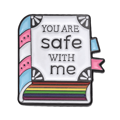 Show your pride with this Kiss Me Later enamel pin—a book featuring trans pride pastel blue, pink, and white stripes on the spine, rainbow-colored pages, and the text You are safe with me. Perfect for any accessory collection!.