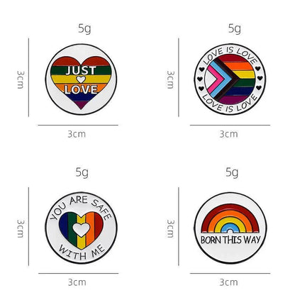 Set of four round rainbow pride enamel pins (3cm, 5g each): Just Love in a heart, Love is Love with chevron, You Are Safe With Me heart, and Born This Way with rainbow. Ships worldwide.